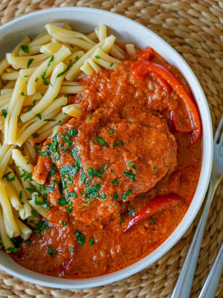 Chicken Paprikash dish with rich paprika sauce served on a plate