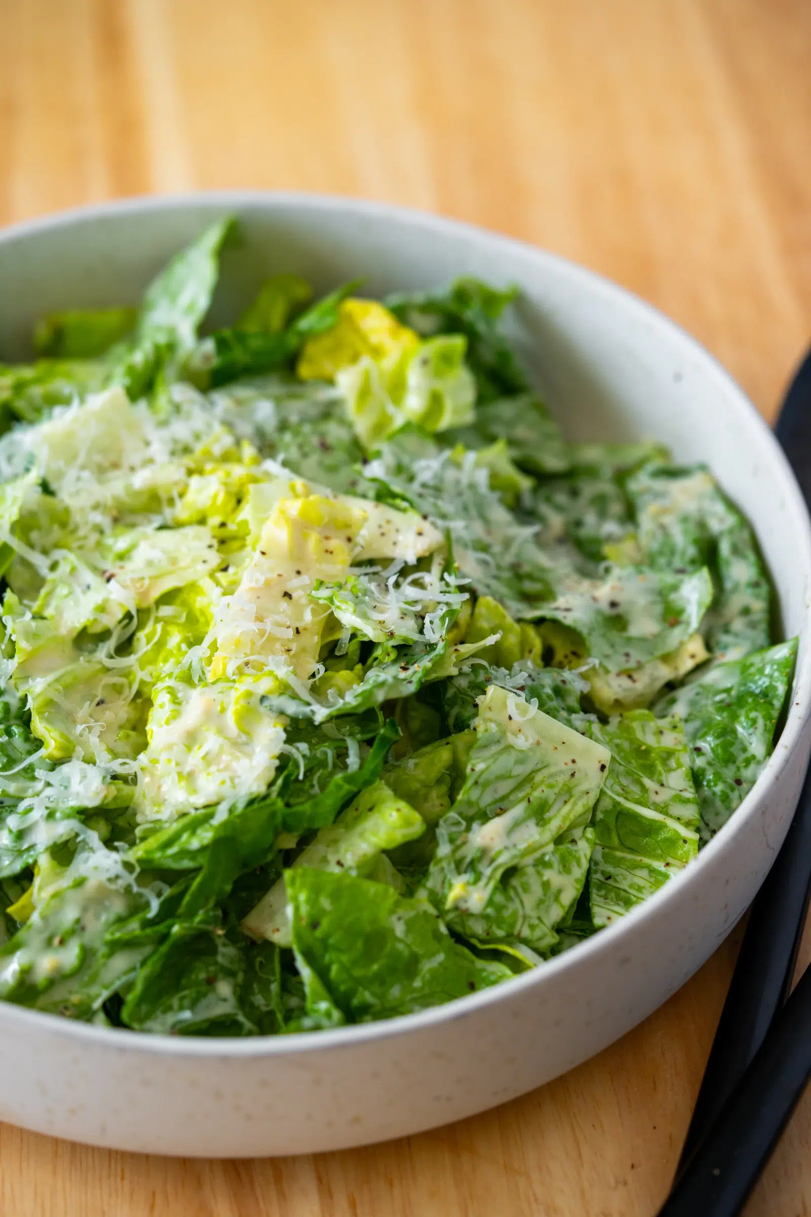 Close Up of Lettuce dressed with Caesar Salad Dressing