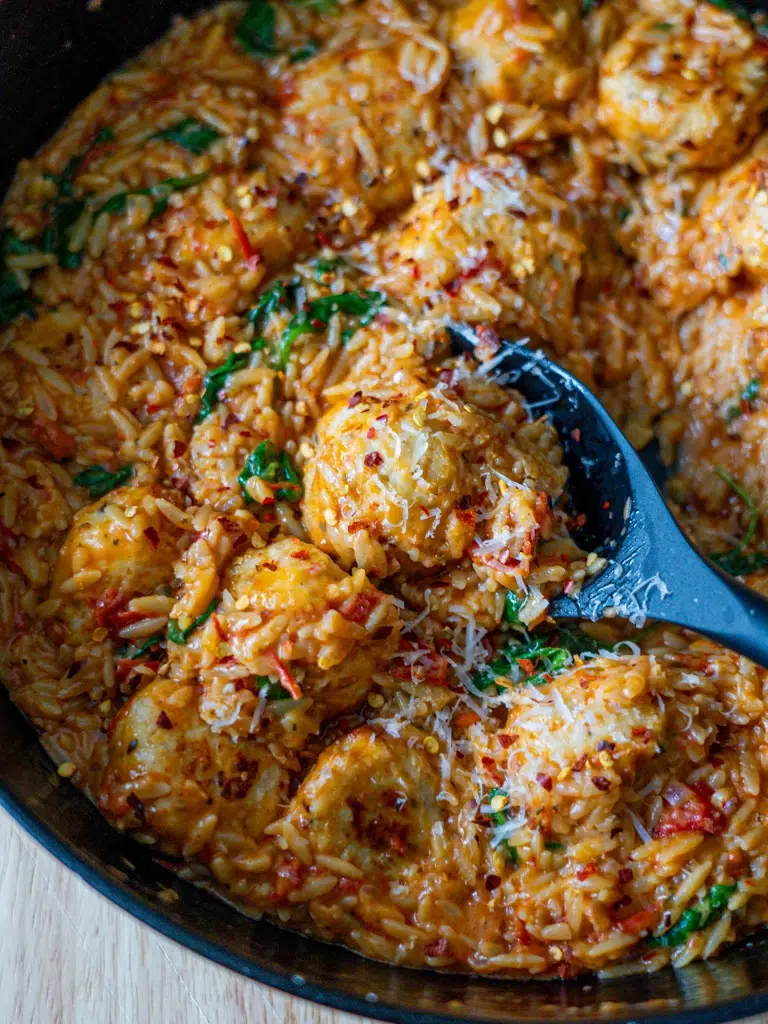 Overhead shot of Marry Me Chicken Meatballs with risoni (orzo) in a creamy, golden sauce.