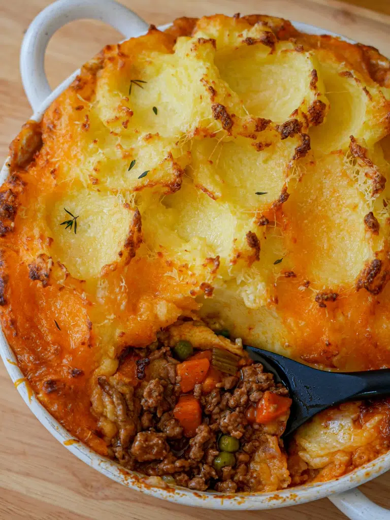 Freshly baked Shepherd's Pie showcasing its creamy potato crust.
