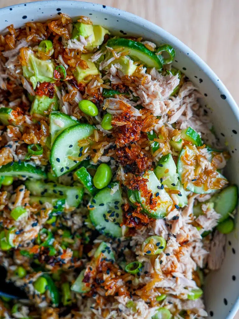 Close-up view of rice with tuna and avocado, showcasing the ingredients in detail.